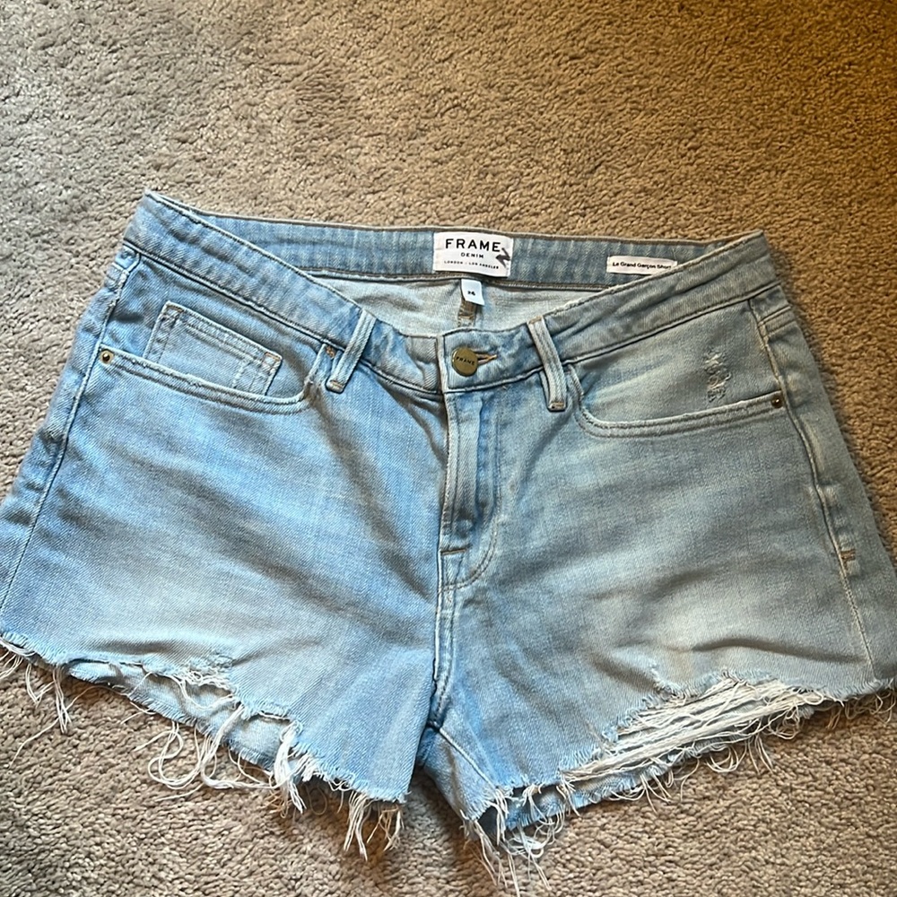 FRAME Denim. Le grand Garçon raw edge denim jeans mini shorts